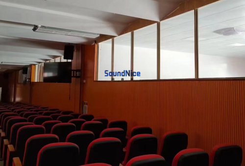 Installation of grooved acoustic panels in lecture hall