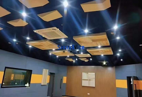 The recording studio uses wall polyester board and solid wood diffuser